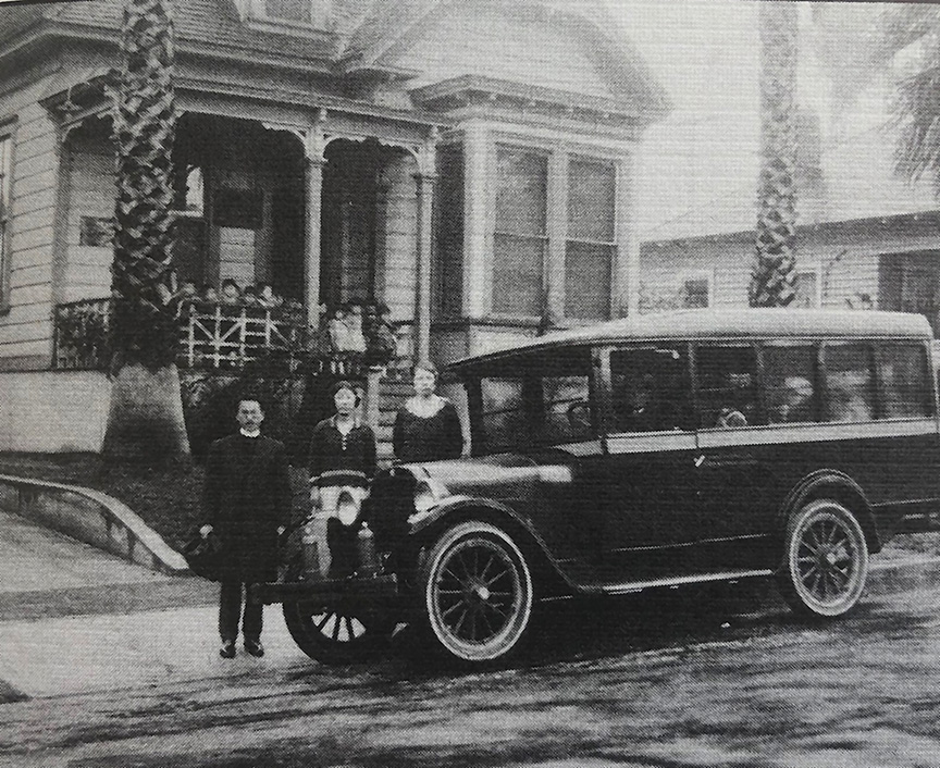 Historic photograph of St. Mary's Episcopal Church schoolchildren with a Dodge bus during the 1918 influenza pandemic